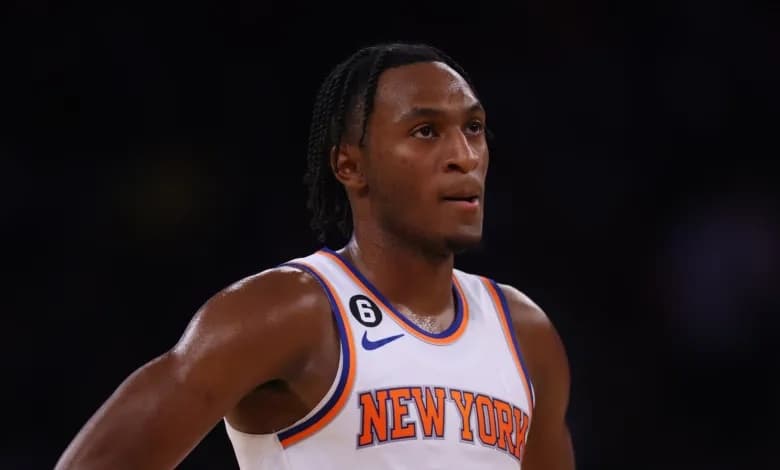 Immanuel Quickley in a white New York Knicks jersey